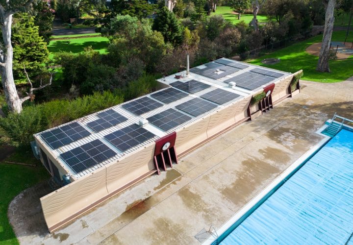 Solar panels installed on a public infrastructure rooftop, reflecting the use of commercial solar for sustainable energy