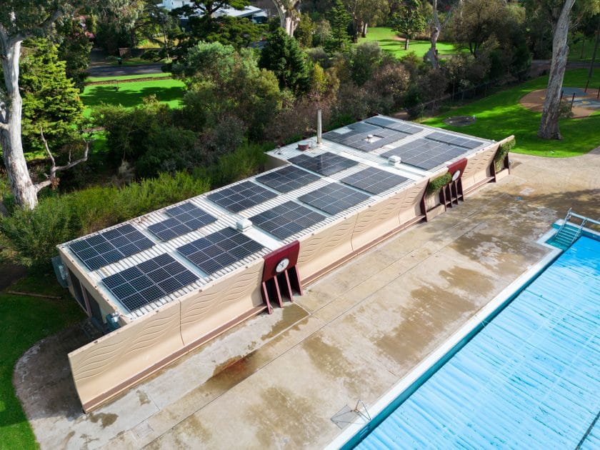 Solar panels installed on a public infrastructure rooftop, reflecting the use of commercial solar for sustainable energy